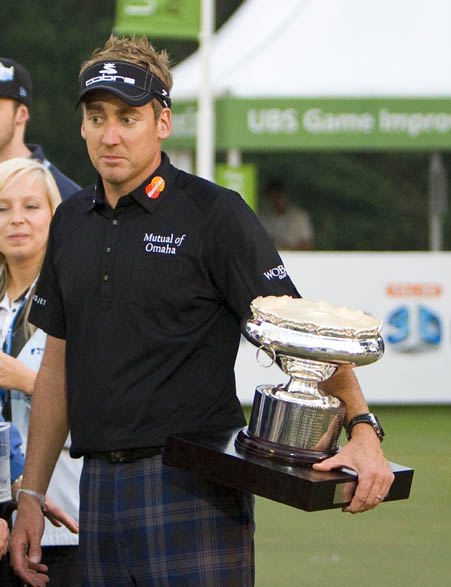 Poulter relaxing with the trophy