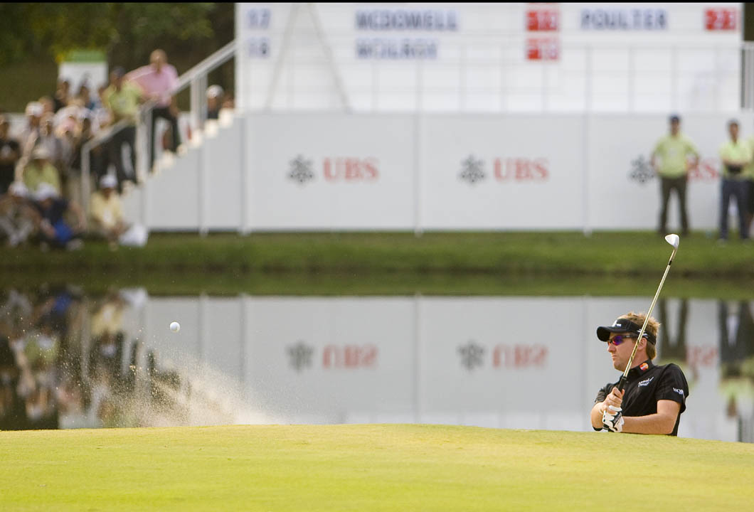 Poulter plays from the bunker on the 72nd hole