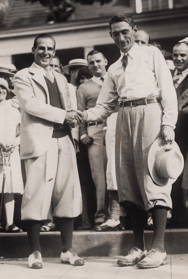 Tommy Armour shakes the hand of Harry "Lighthorse" Cooper following his triumph in 1927