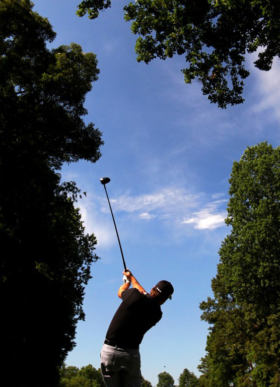 Graeme McDowell hits a tee shot during a practice round