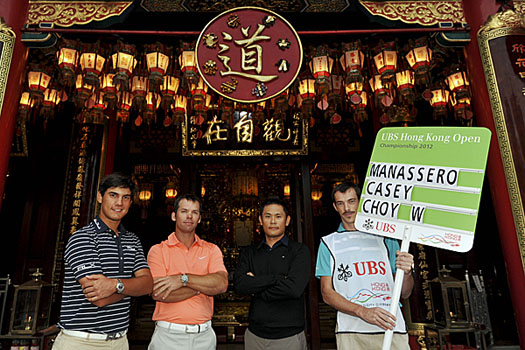 Matteo Manassero (L), Paul Casey (C) and Wilson Choy relax at the Wong Tai Sin Temple