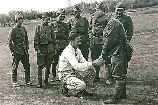 Kirkwood giving a lesson to Japanese soldiers at the club