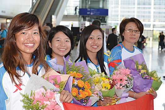 The women’s team of Tiffany, Mimi, Kitty and Wong on their arrival back in Hong Kong