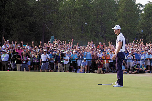 Kaymer reacts to holing a lengthy par putt on the 72nd hole at Pinehurst