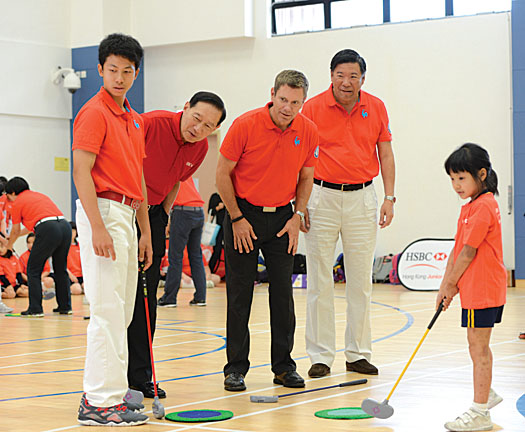Peter Wong; Brad Schadewitz, National Coach of the HKGA and Ning Li, President of the HKGA participating in the ShortGolf activity with local students and young National Team member, Michael Regan Wong