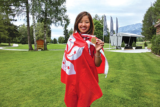 Tiffany Chan celebrating her 2014 gold medal success at Crans Montana in the Swiss Alps
