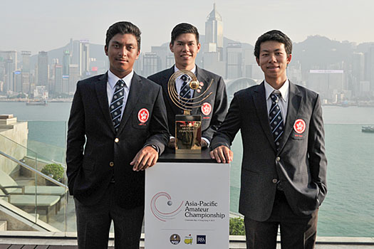 Hong Kong's Leon D'Souza, Matthew Cheung and Michael Regan Wong pose with the championship trophy