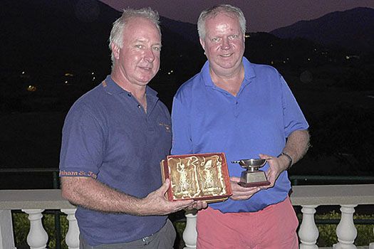 Alan McTaggart presents the trophy to winner Roy Kinnear