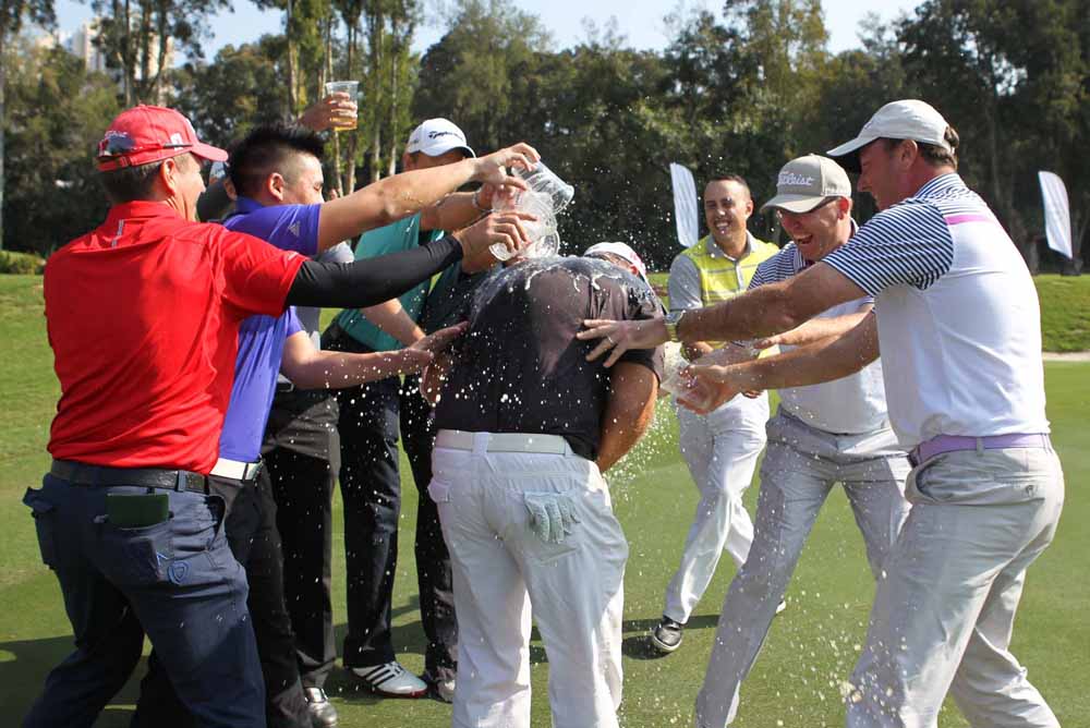 Barr being showered by his fellow competitors after holing the winning putt