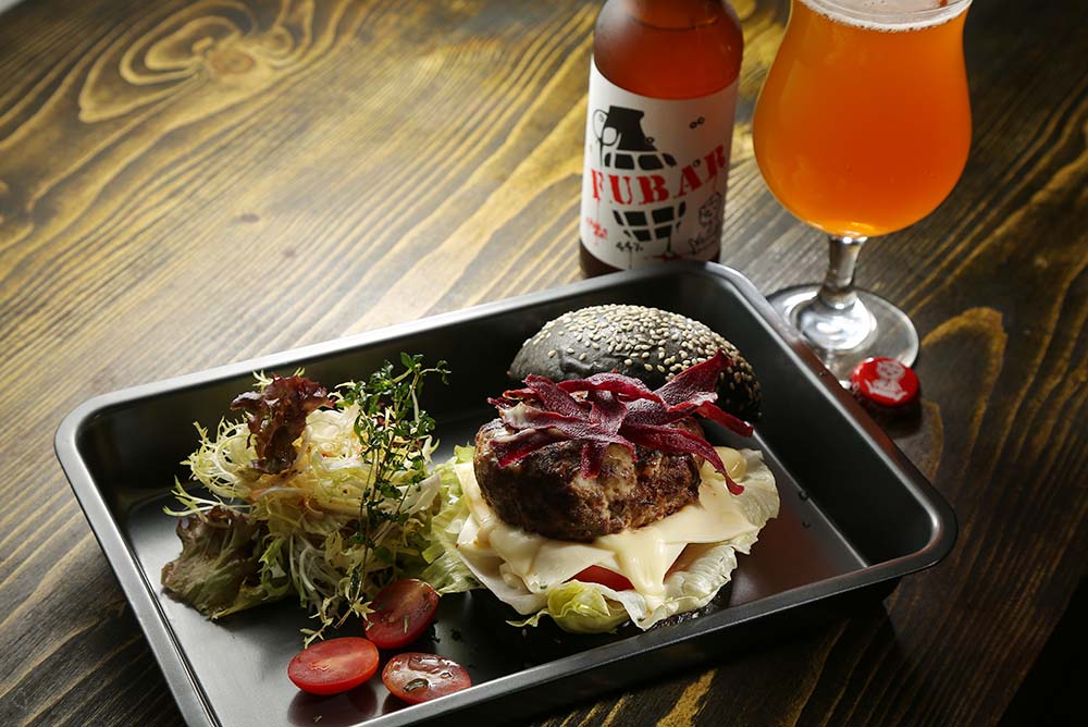 Snkrholic, located near the Sneaker Street in Mongkok, has a very tidy selection of craft beers. Their Great British Burger goes pretty well with an interesting mix of UK labels
