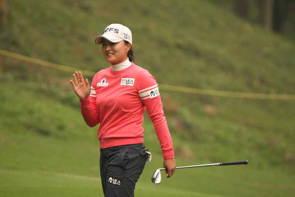 Jing Yung Ko reacts to a birdie putt