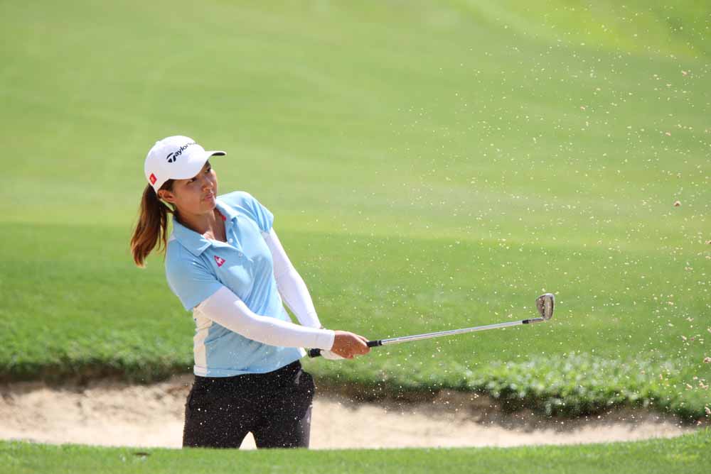 Tiffany Chan hits a bunker shot