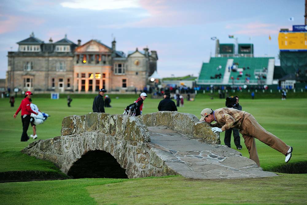 Tom Watson kisses the Swilcan Bridge during the 2010 British Open