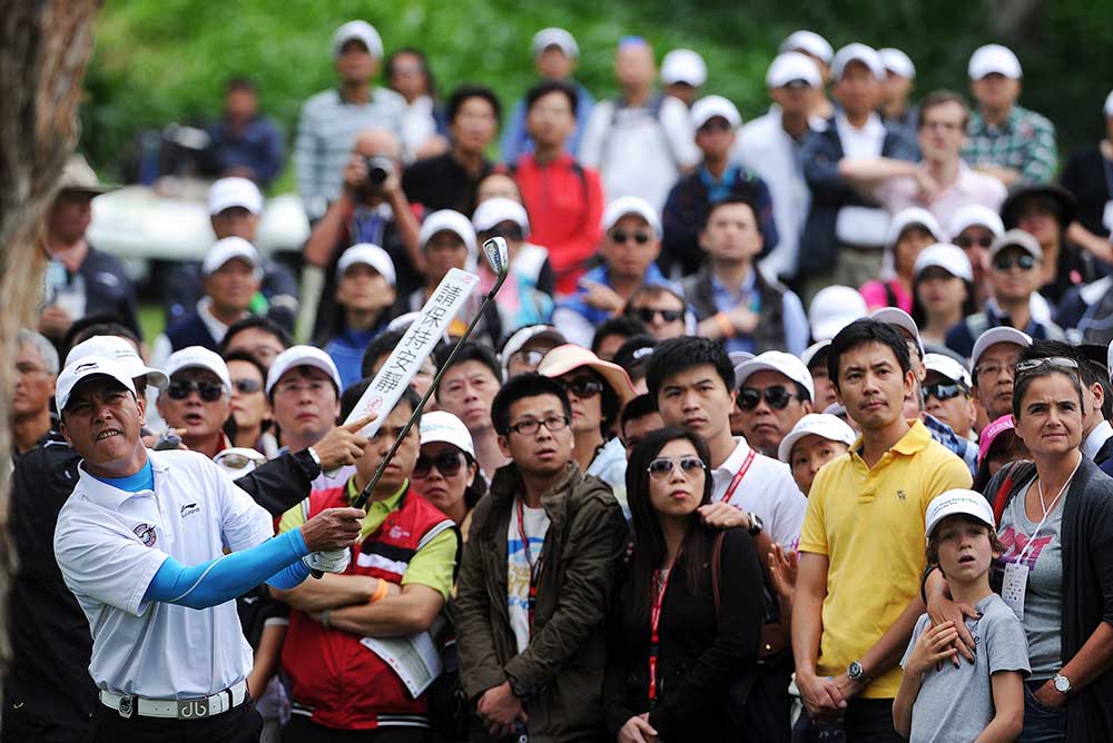 Zhang Lian-wei, who taught himself to play golf in 1990s, is the icon of the first generation of mainland Chinese golfers. The picture shows his tee-off from behind a tree during the 2012 UBS Hong Kong Open