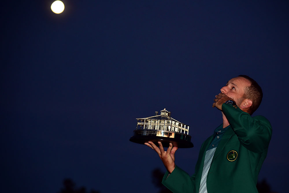 Sergio Garcia holds the trophy and points his finger to heaven to pay tribute to the legendary Seve’s 60th birthday