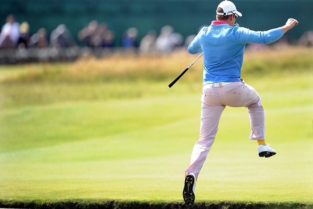 Henrik Stenson jumps over the famous Swilcan Burn