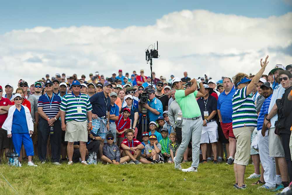 Brooks Koepka hits his second shot on the 7th during the final round