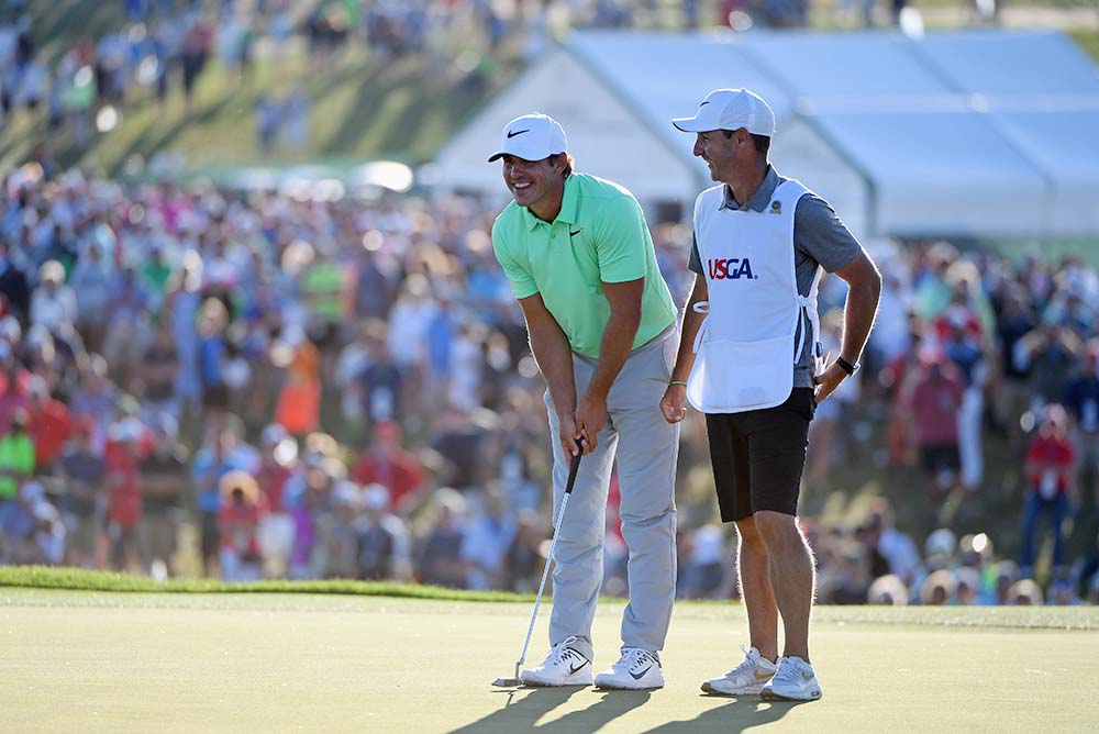 Brooks Koepka and caddie Richard Elliott