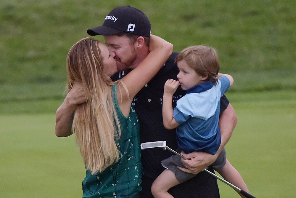 Jimmy Walker celebrates with his wife Erin and son Beckett