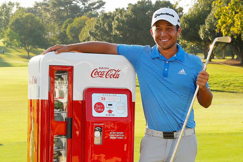 Schauffele celebrates with the Calamity Jane trophy after winning the TOUR Championship
