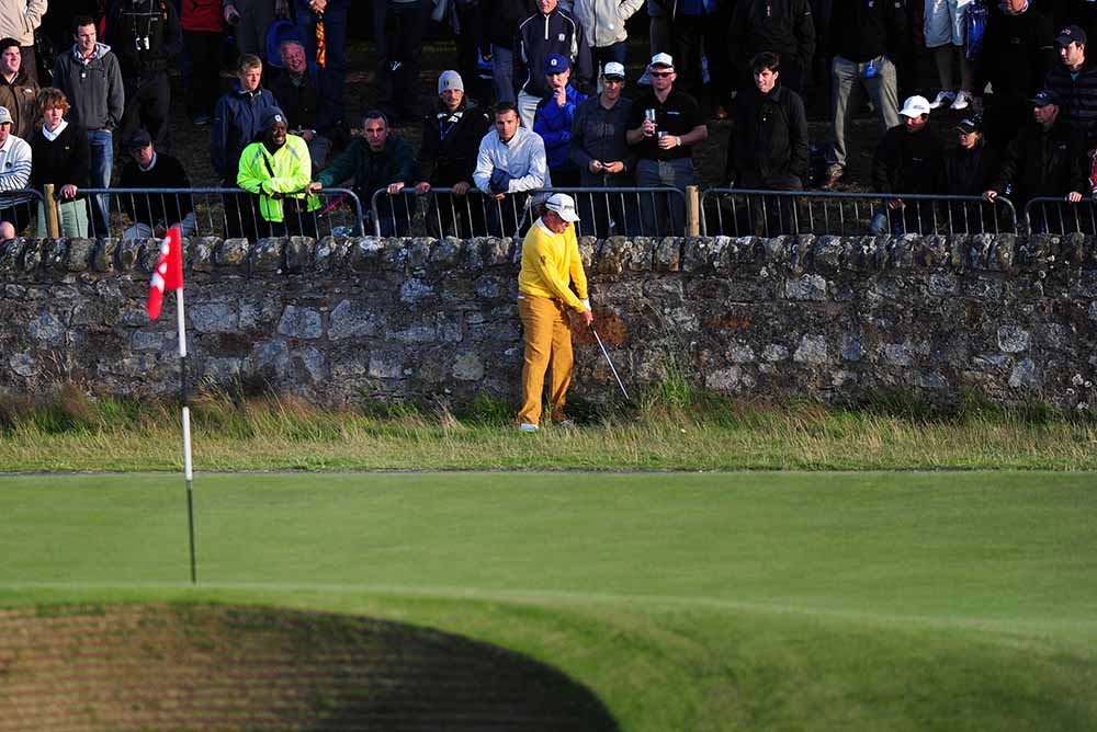 Miguel Angel Jiménez plays his ball back off the wall onto the road hole Green