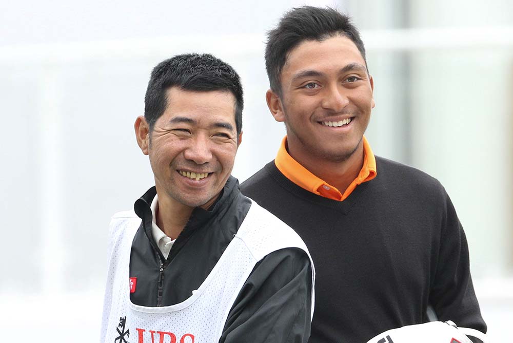 Leon D’Souza with his coach and caddy Ducky Tang