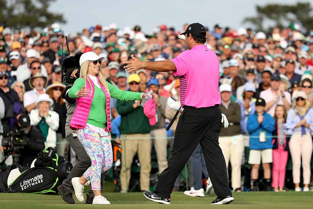 Patrick Reed celebrates with his wife Justine during the 2018 Masters Tournament