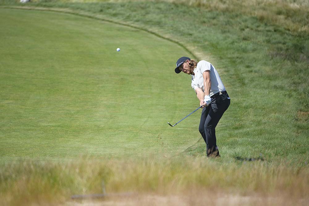 Tommy Fleetwood hitting on the 16th fairway