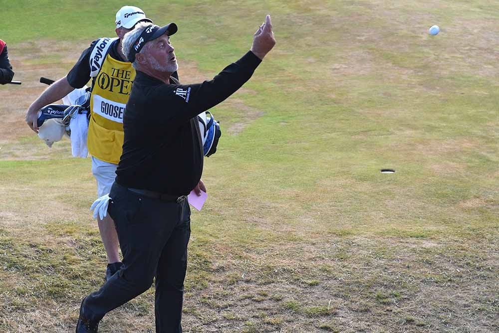 Darren Clarke throws his ball into the crowd