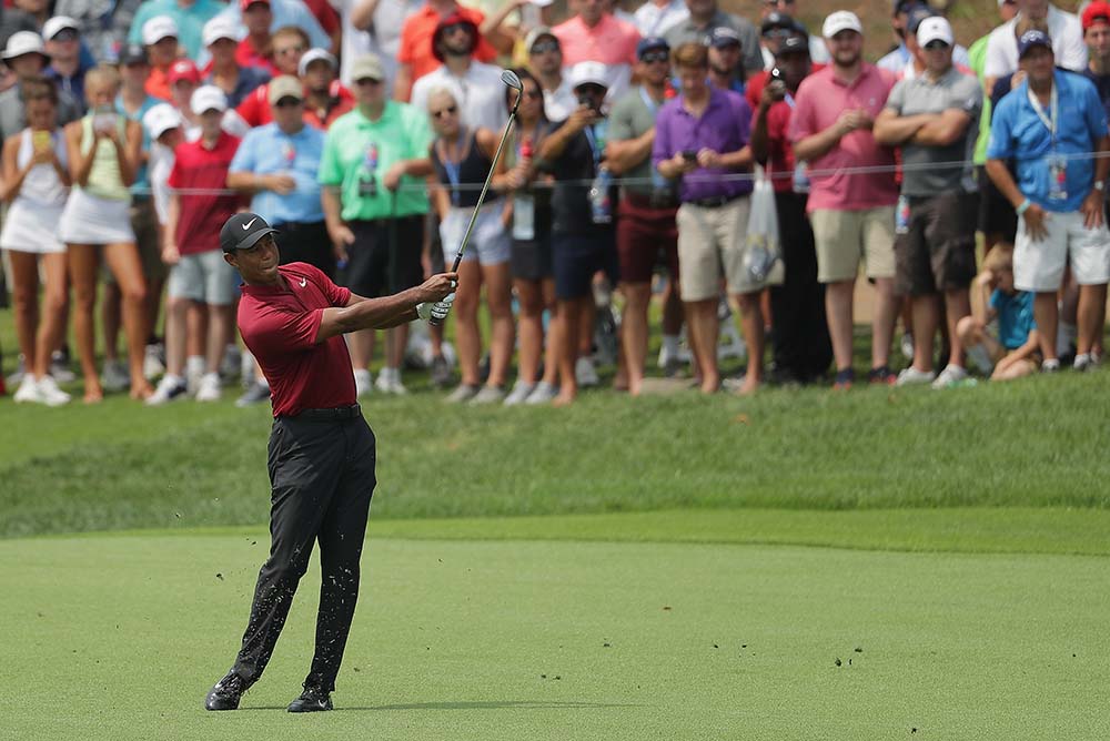Tiger Woods plays a shot on the 4th