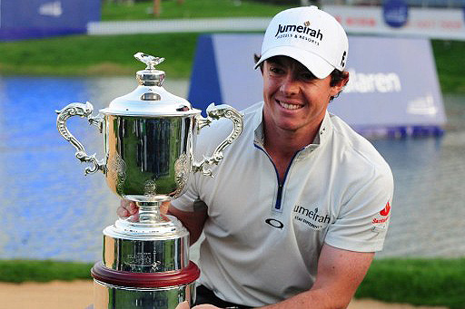 McIlroy poses with the championship trophy after claiming US 2 million dollar prize
