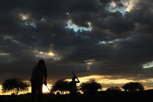 Pat Perez (pictured) putts in the fading light