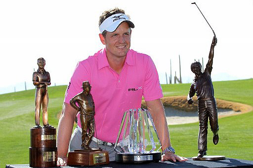 Luke Donald poses with the Arnold Palmer Award, the Byron Nelson Award, the Jack Nicklaus Trophy, and the Mark H. McCormack Award