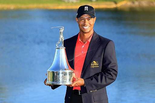 Tiger Woods poses with the Arnold Palmer Invitational Trophy after claiming the title by 5-shots