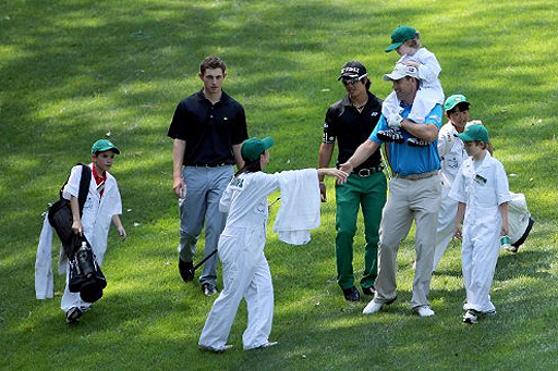 Padraig Harrington (far right) walks with Ryo Ishikawa and Patrick Cantlay (middle and left)