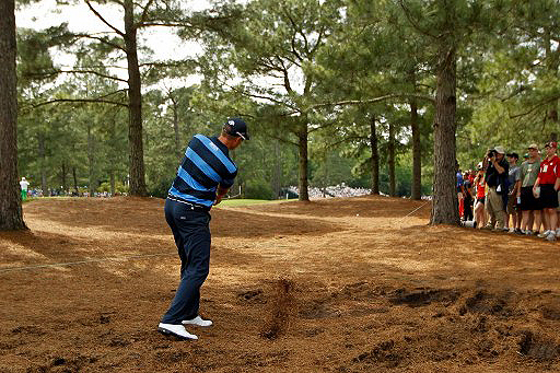 Henrik Stenson tries to recover from a missed tee shot