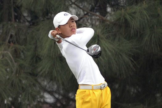 Guan Tian Lang tees off at the par-5 12th in qualifying