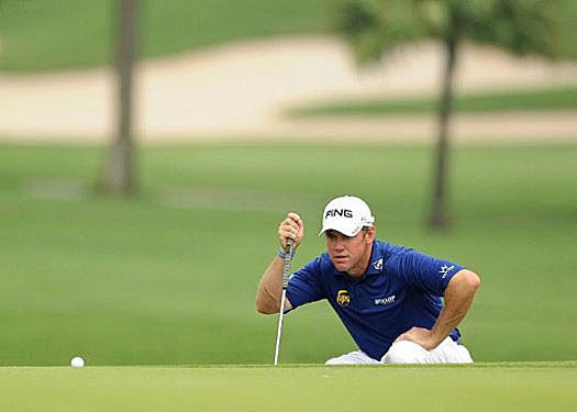 Lee Westwood eyes up a putt at the CIMB Niaga Indonesian Masters