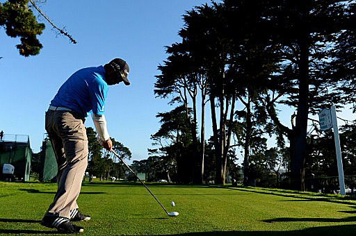 Andy Zhang hits a tee shot during practice