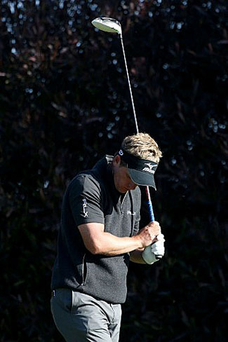 Luke Donald reacts to a poor shot on the 17th hole