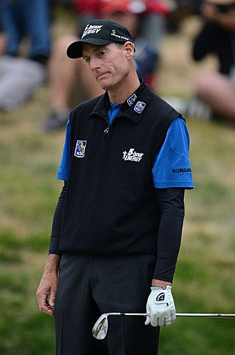 Furyk reacts to his bunker shot on the 18th in the final round