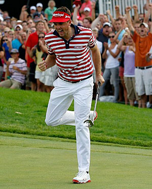 Bradley celebrates a 15-foot putt on the 18th green