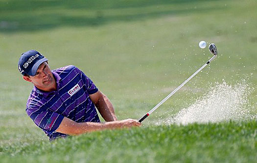 Padraig Harrington seizes the first-round lead with a seven-under 64 