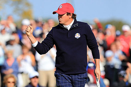 Jason Dufner celebrates a birdie putt