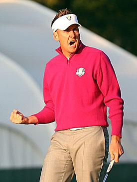 Ian Poulter celebrates a birdie putt