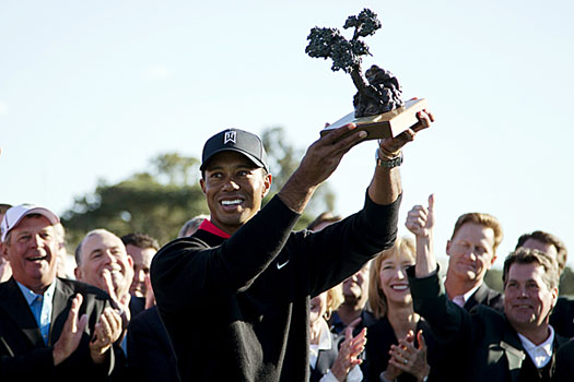 Tiger Woods celebrates his record-setting eighth career triumph at Torrey Pines