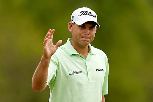 Bill Haas reacts to the crowd after birding the 16th hole 