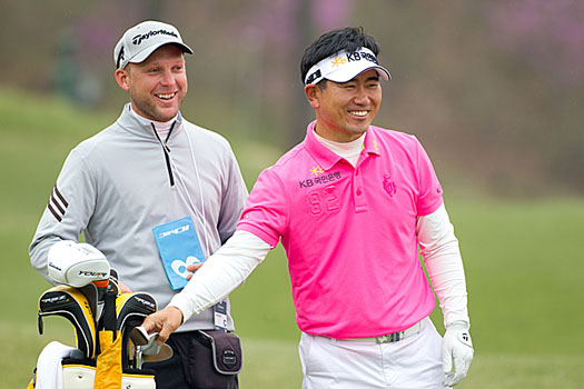 Y.E. Yang with his caddie, James Walton during his practice round