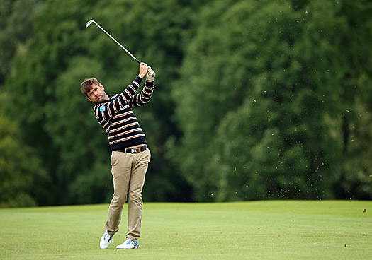 Robert Rock signs for a round of 66 for a nine-under par total of 135