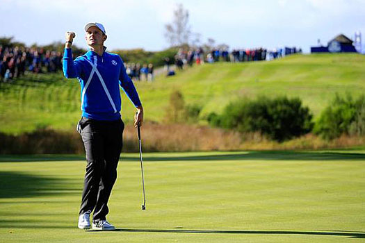 Justin Rose of Europe celebrates a putt on the 6th hole